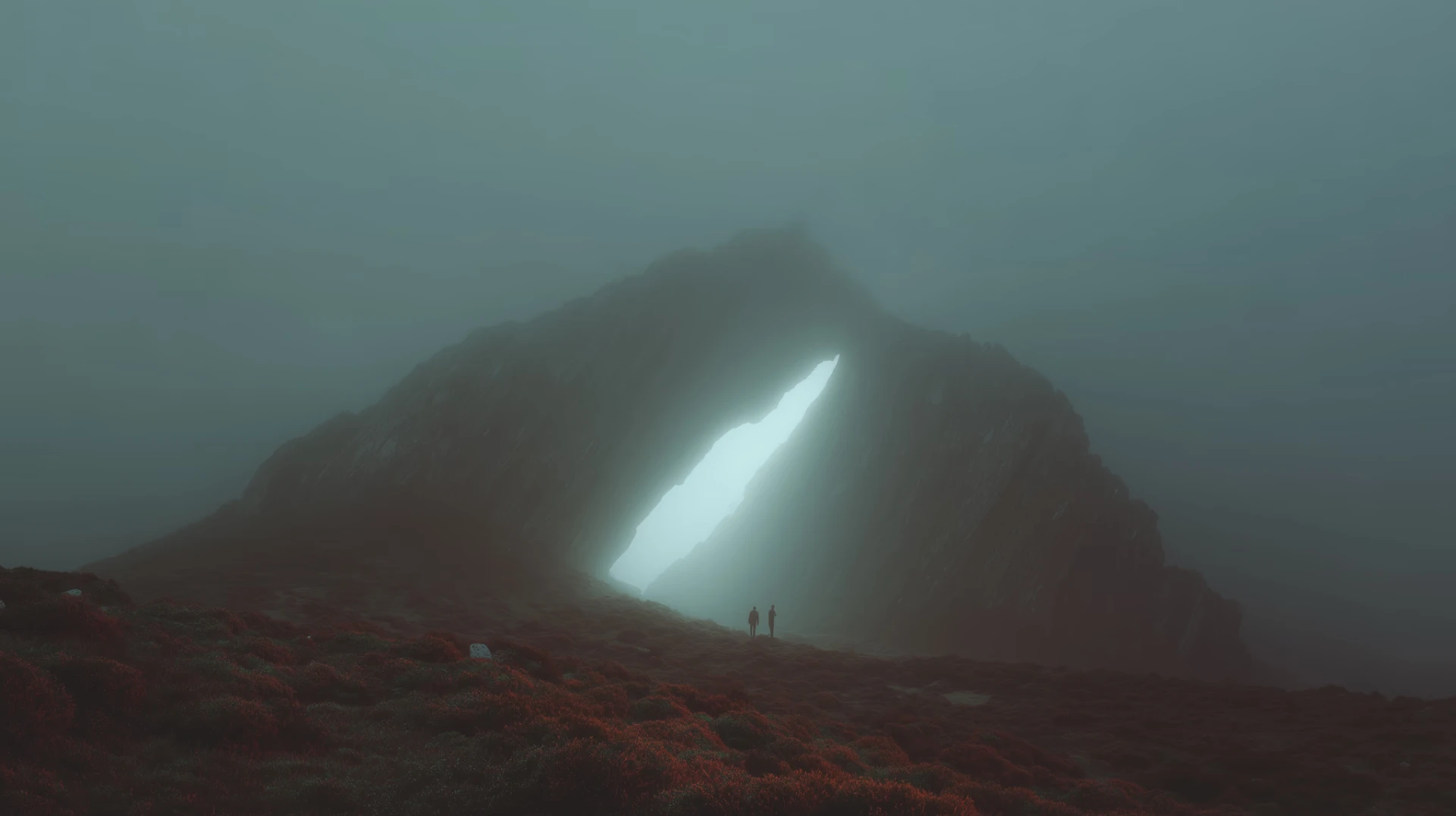 Two figures walking toward a glowing opening in a misty mountain